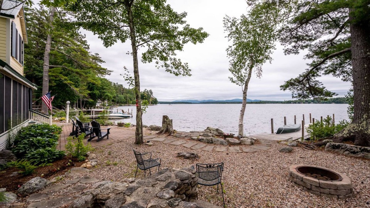 Melvin Village House | Timeless lakefront home on Lake Winnipesaukee with screened-in porch and dock