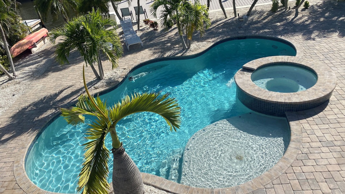 Fort Myers Beach House | Times Square Gem! 4BR Canal front home, private Pool/Spa, Sleeps 12