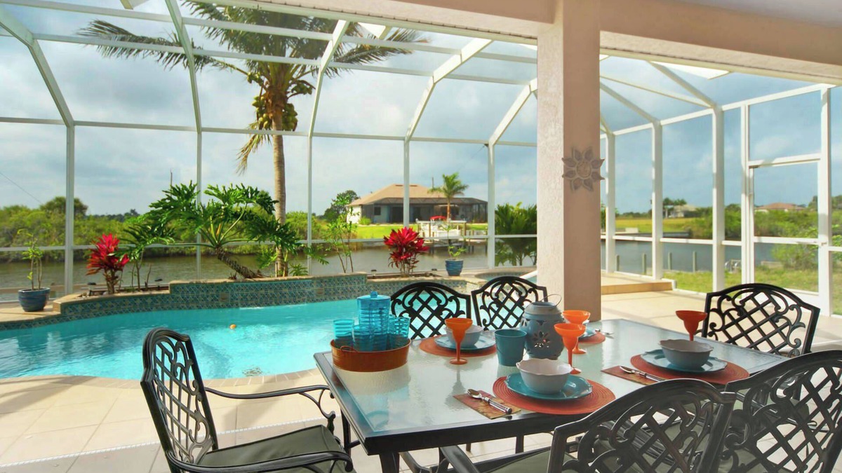 Burnt Store House | Tommy Bahama-style electric-heated pool home on Gulf-access canal - Villa Ellis