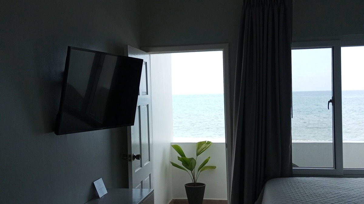 Sector 2 House | Top floor stylish Queen room, balcony with great Caribbean view. Parking,Netflix