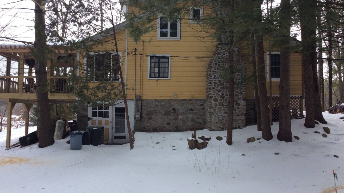 Wells House | Tranquil lakefront home sits above the lake with an unobstructed view
