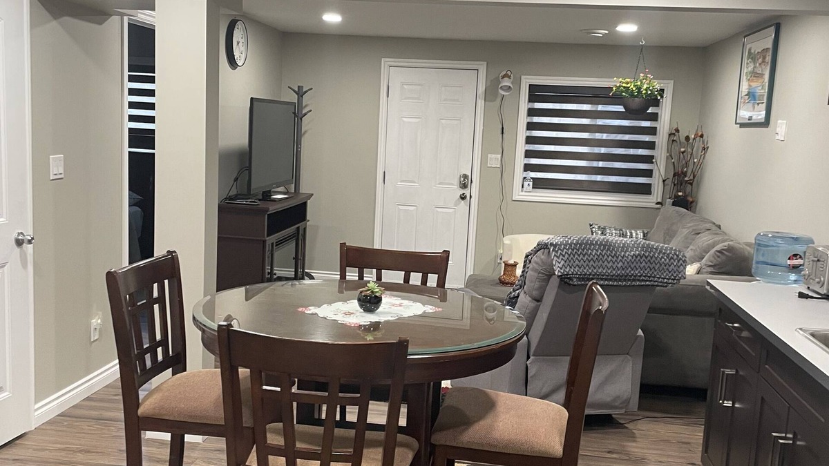 Stony Plain House | Tree facing back yard walkout unit at stony plain