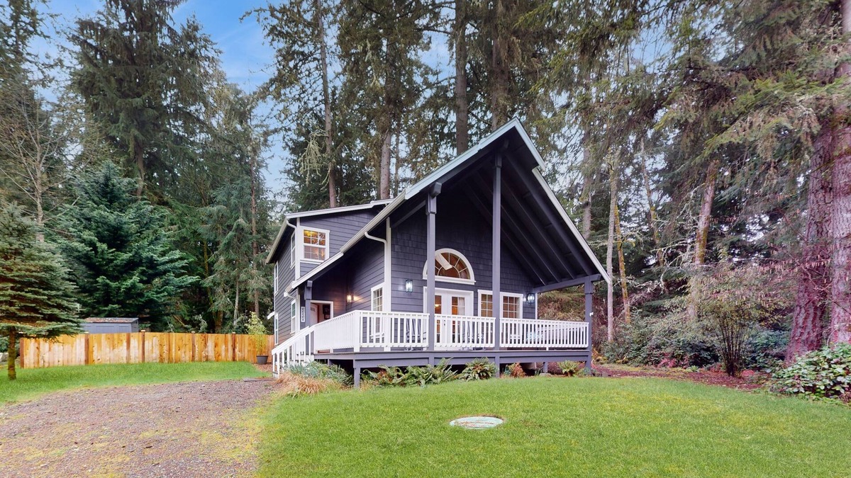 Anderson Island House | Tree-lined Anderson Island home with porch & fenced yard, near dock/tennis