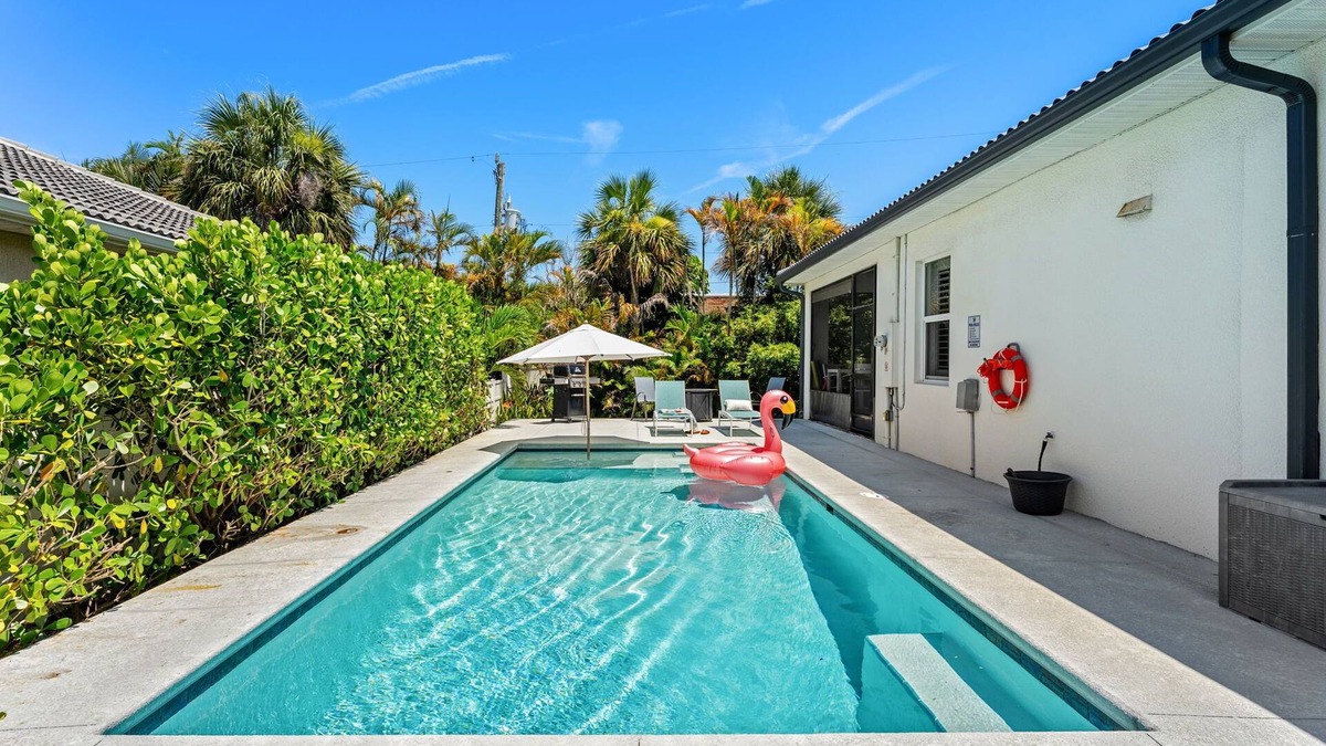 Cocoa Beach House | Tropical Backyard Oasis w/Screened in Outdoor Patio, Pool, Gas Firepit & BBQ Grill!