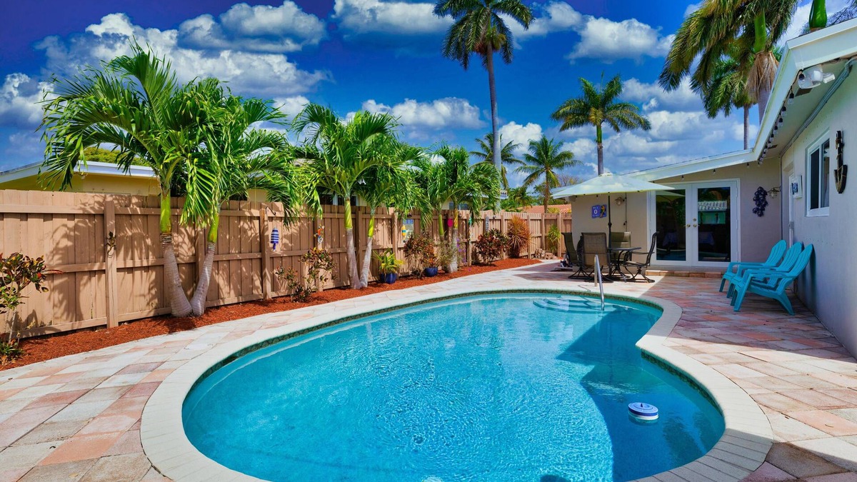 Cypress Point House | Tropical Getaway! Walking distance to beach & dining, private home, heated pool.