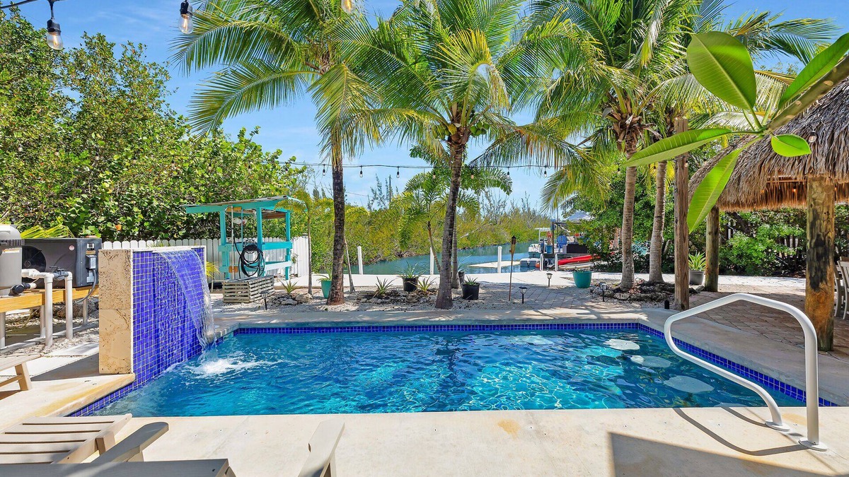 Sugarloaf Key House | Tropical paradise on canal in Lower Keys-pool, tiki, firepit, dock, dog friendly