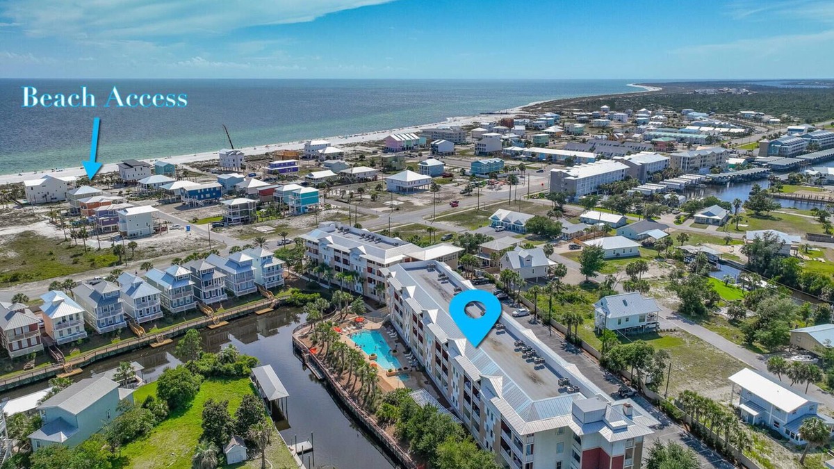 Waterside Village Condo | Tropical Retreat with Canal Views, Beach Service, Pool, Hot Tub
