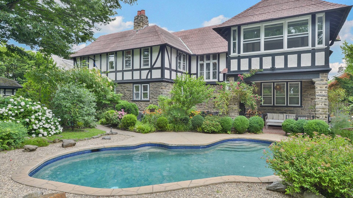 West Mount Airy Villa | Tudor Mansion With Outdoor Oasis and Swimming Pool