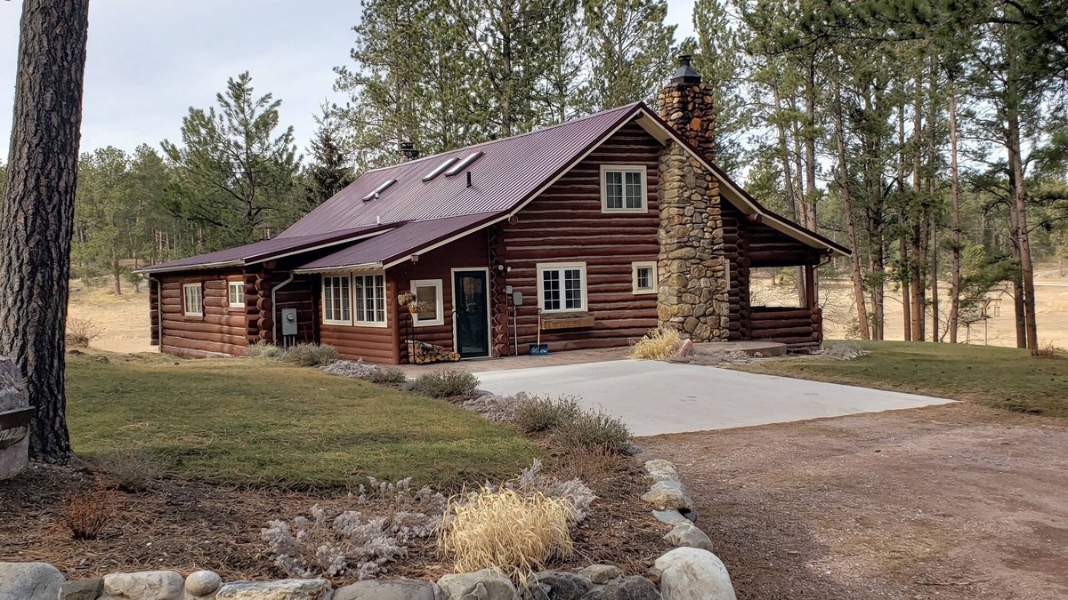 Custer House | Two story authentic log construction home, built in 1936 with two fireplaces.