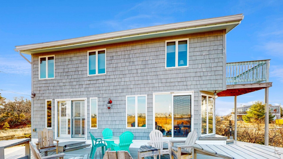 Newbury House | Two-story riverfront retreat with a furnished deck, views, & washer/dryer