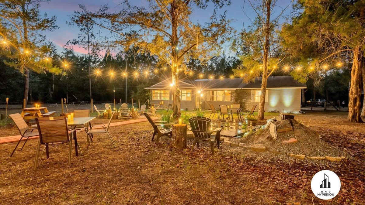 Eustis House | Uhost AI | 4BR Getaway |Cozy Firepit & Hot Tub Fun