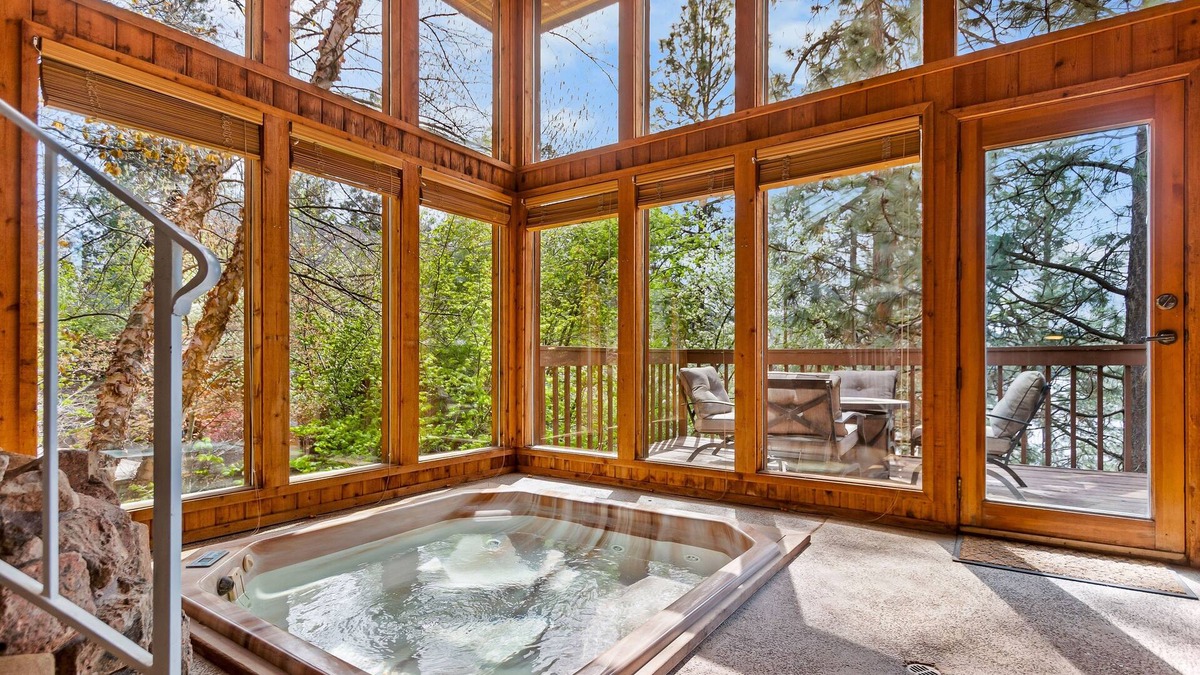 Liberty Lake House | Unique lakefront hideaway with four decks, dock, private hot tub & wood stove