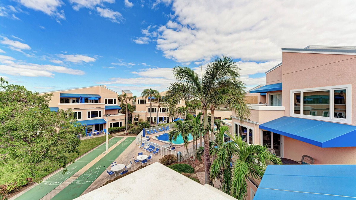 Whitney Beach Condo | Unit #313 Sand Cay Beach Resort Pool and Garden