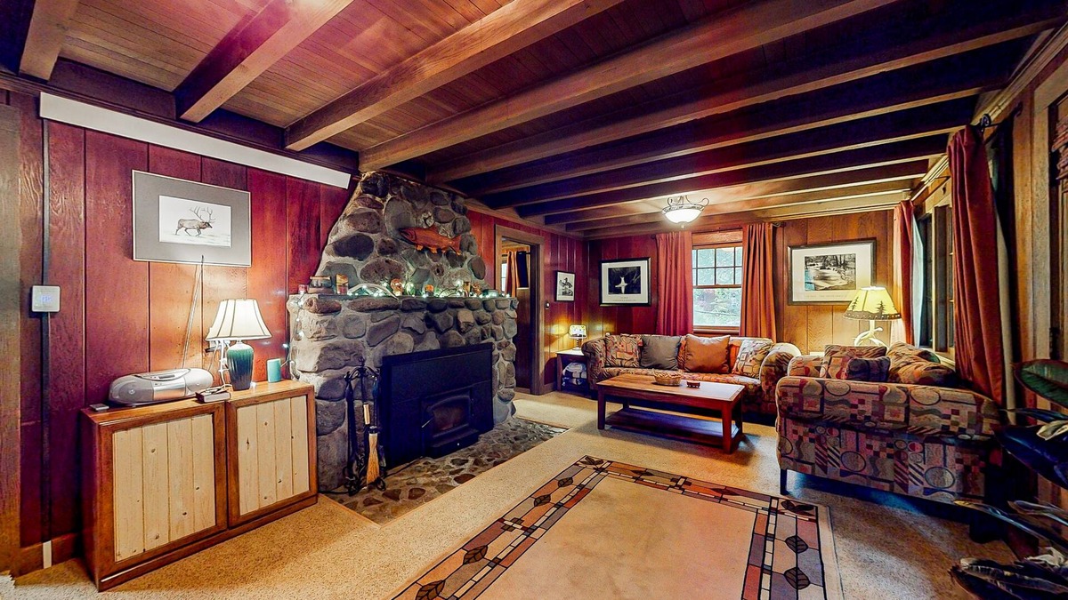Marmot Apartment | Unwind in nature's embrace at a 1925 cabin with hot tub & river views