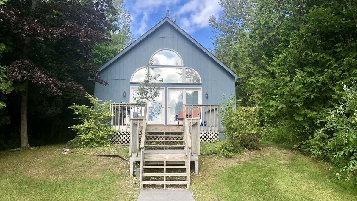 Suttons Bay House | "Up north" waterfront lodge on West Bay. Spacious deck with gas grill.