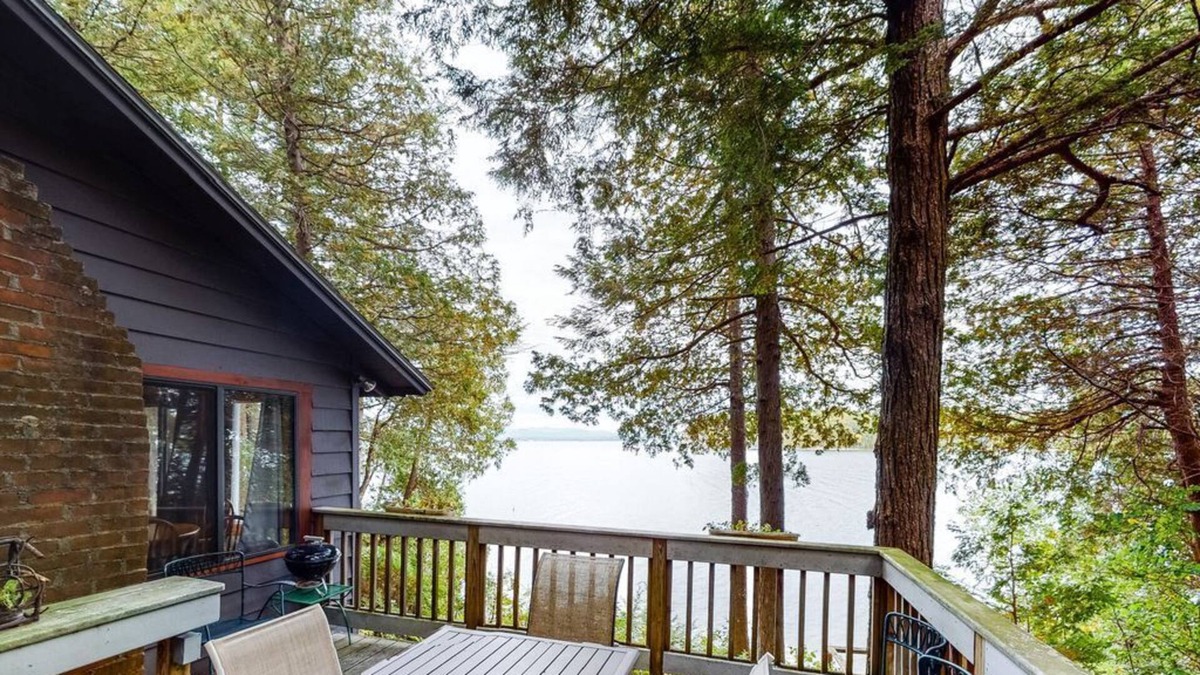 Charlotte Cottage | Updated lakefront home in a wooded setting with private dock & beach access