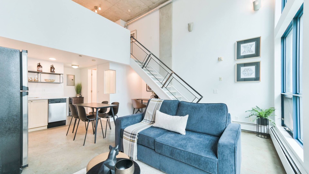 East Village Condo | Urban Loft | 5 Mins to Saddledome | Heated Parking | Sofa Bed