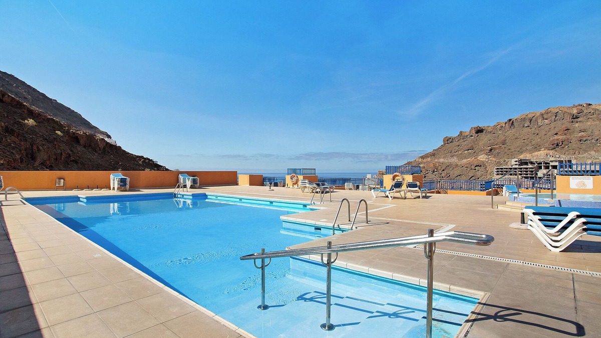Taurito Apartment | Vacation Apartment 'Paraíso Taurito' with Sea View, Terrace, Shared Pool & Wi-Fi