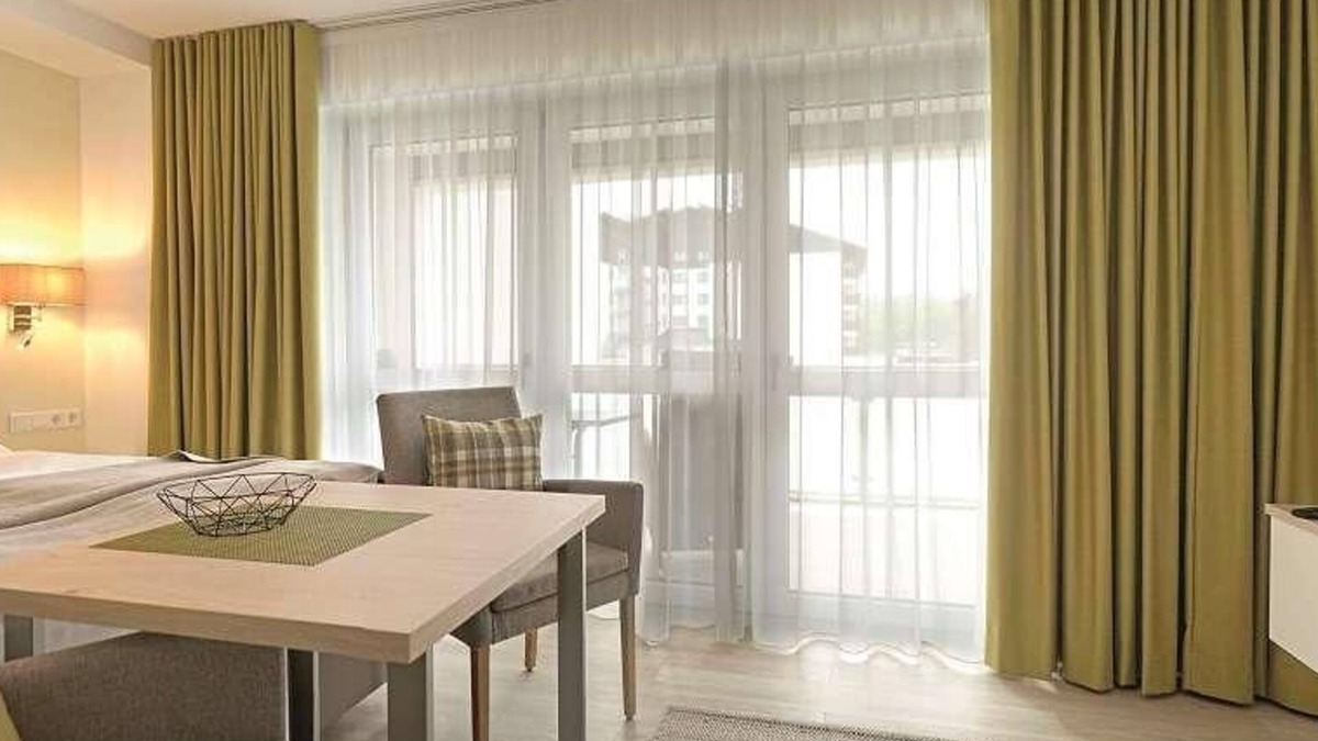 Bad Fuessing Apartment | Vacation home with box-spring bed and south-facing balcony