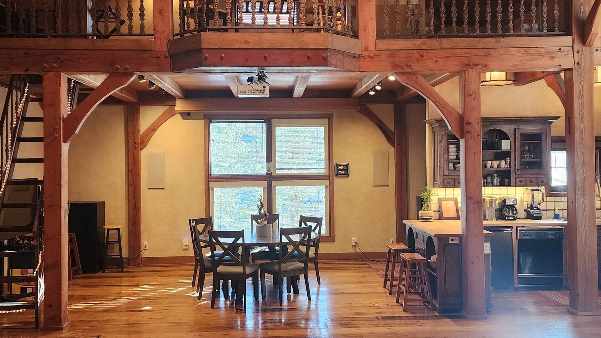 Sundance Cabin | Vaulted beam ceilings, a huge rock fireplace, stream nearby, large campfire area