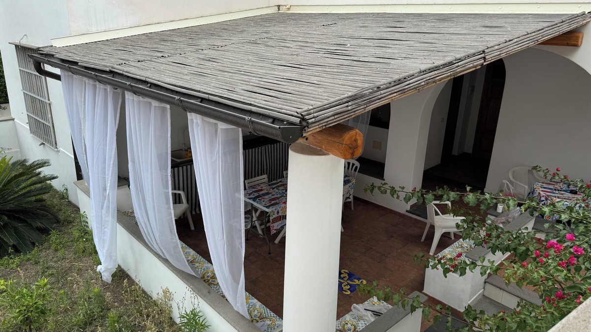 Stromboli Villa | Villa with patio surrounded by greenery, equipped kitchen on the patio. Close to the sea