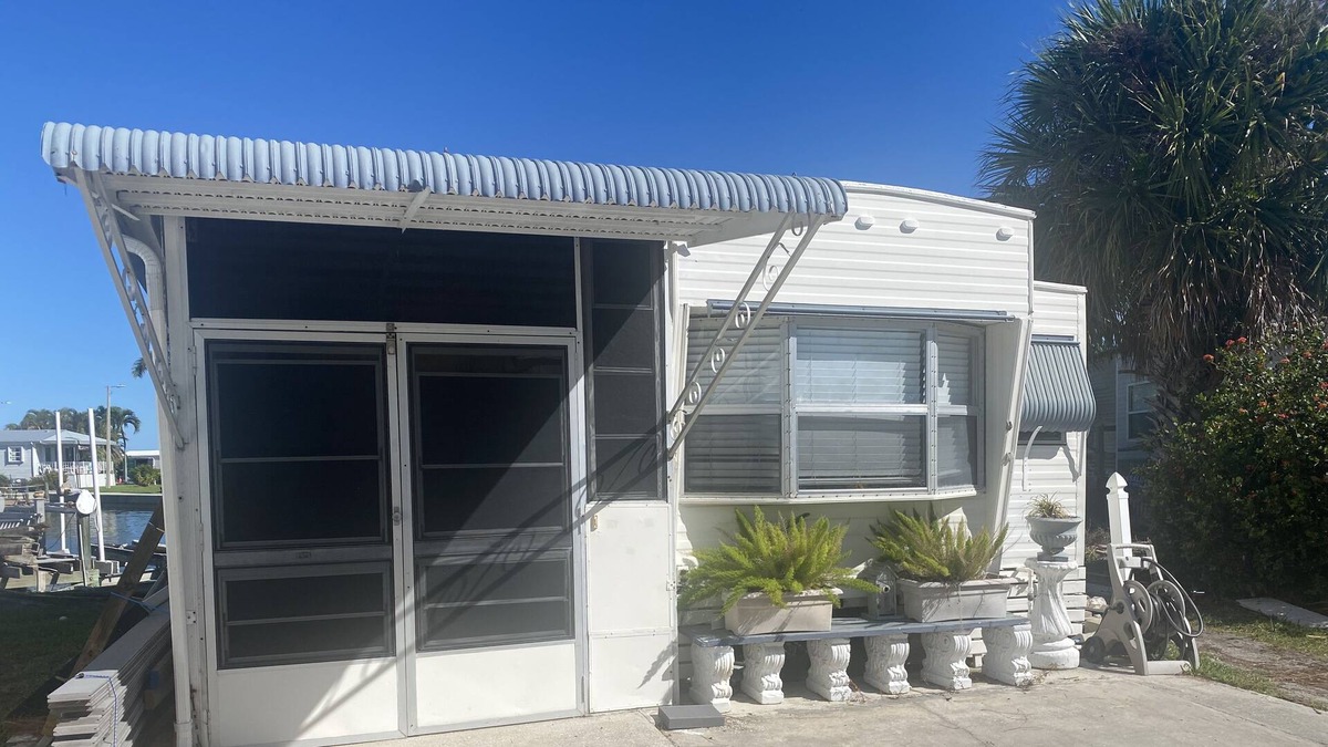 Nettles Island Cottage | Vintage cozy beach house waterfront on grand canal with dock