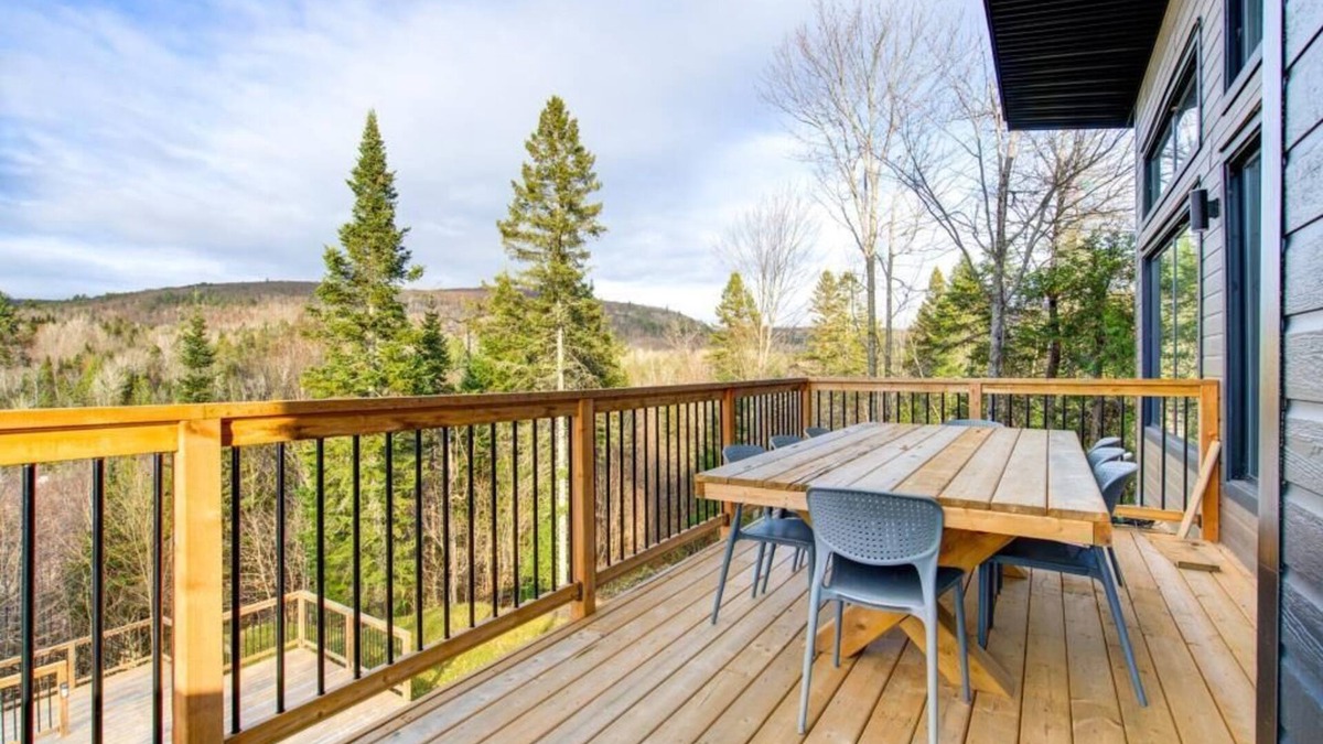 Sainte-Beatrix Ski Chalet | Vulcano Sauna and Spa, modern chalet with water access.