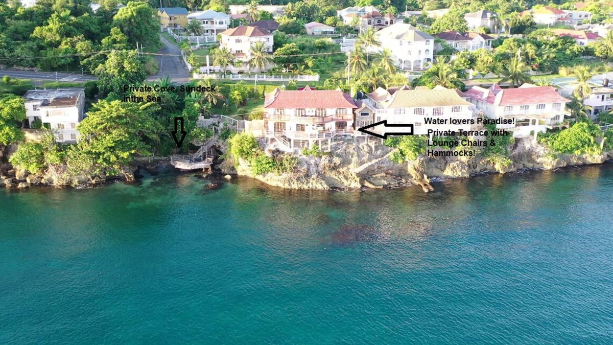 Tower Isle Apartment | Wake up to panoramic ocean views & relax by your own private jetty steps away.n
