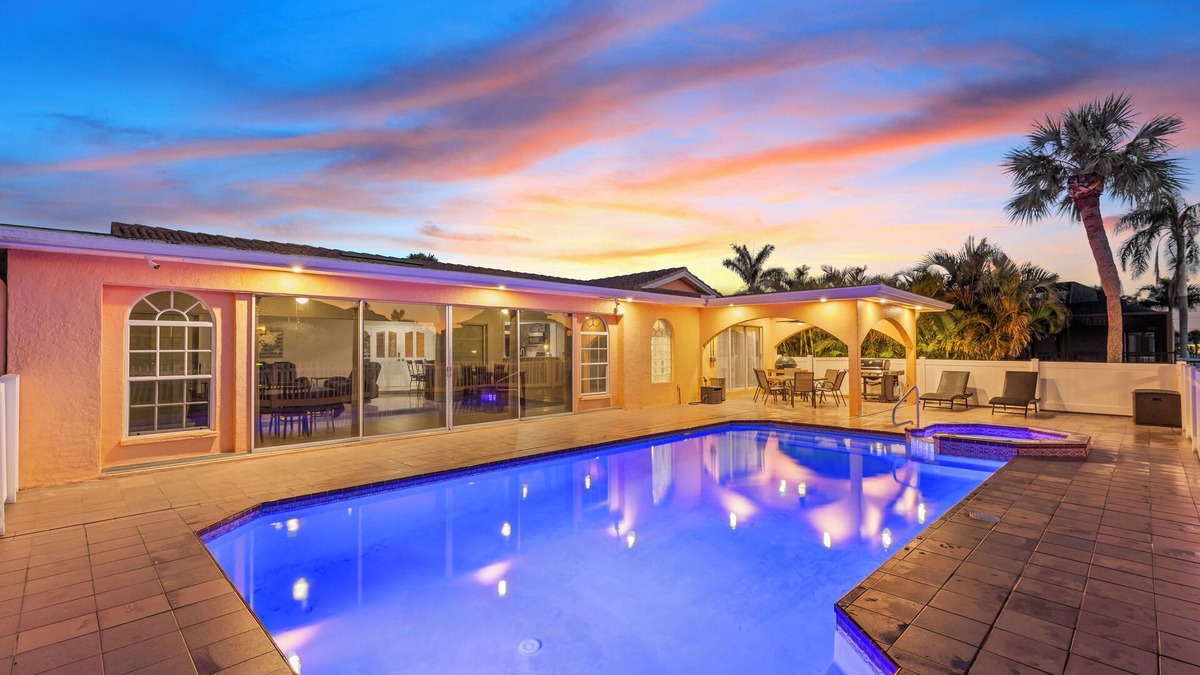 Gulf Harbors House | Water Front Home with Heated Pool & Hot Tub, 2 Master Suites & a Floating Dock