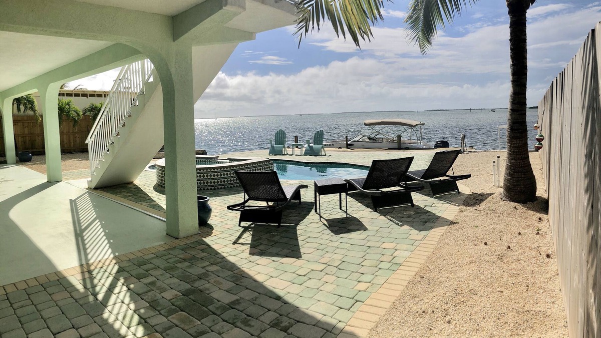 Breezeswept Beach Estates House | Water Front Home. Direct deep water access with private pool/spa/dock & Elevator