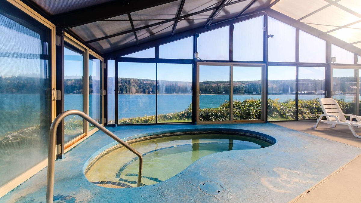 Port Ludlow Condo | Water-view condo with deck, grill, yard games, resort pools, hot tub, and gym