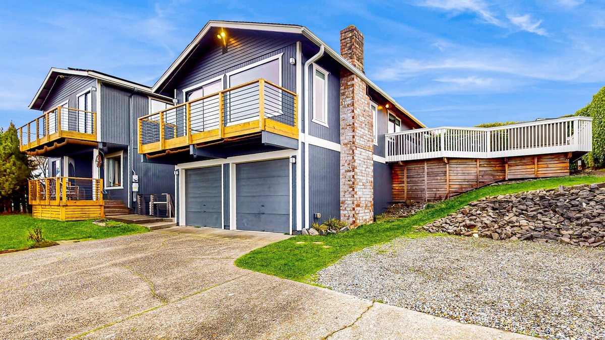 West End House | Water-view home with ADU, gated entry, hot tub, enclosed yard, deck, & 2 W/Ds