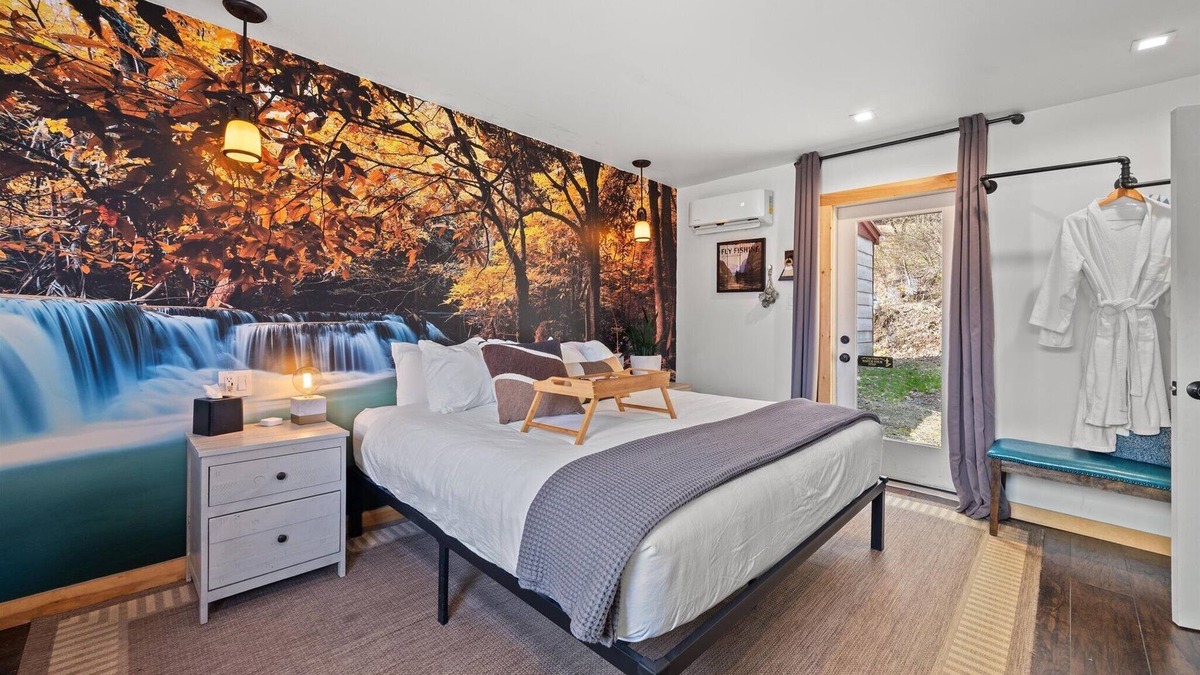 Hancock Hotel | Waterfall Retreat | Serene Room with Forest Mural at Green Acres Retreat