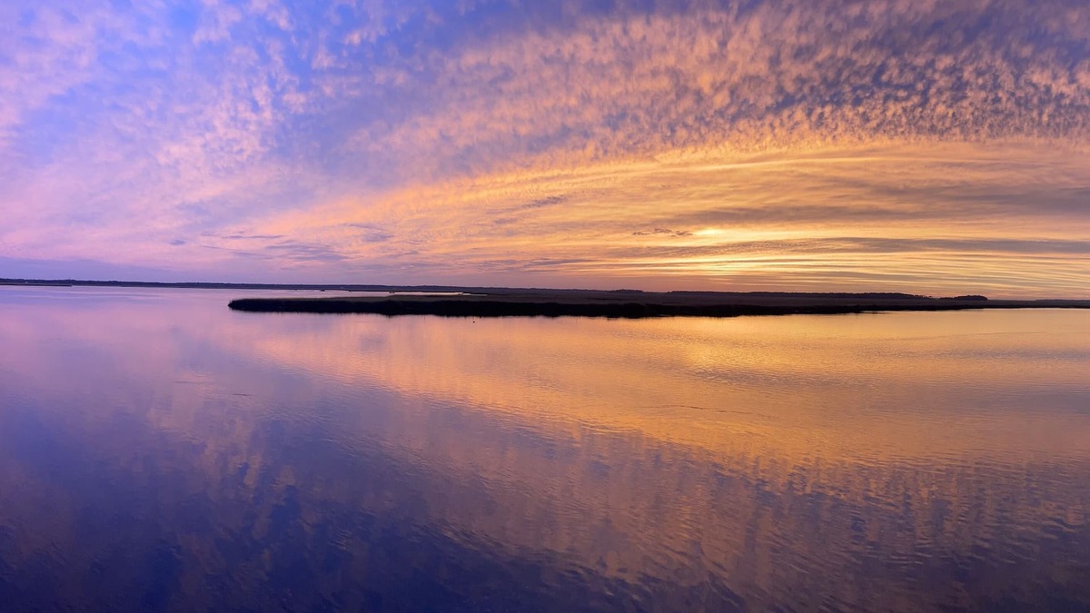Northside RV Rental | Waterfront campsite, a serene oasis for nature lovers and fishing enthusiasts! n