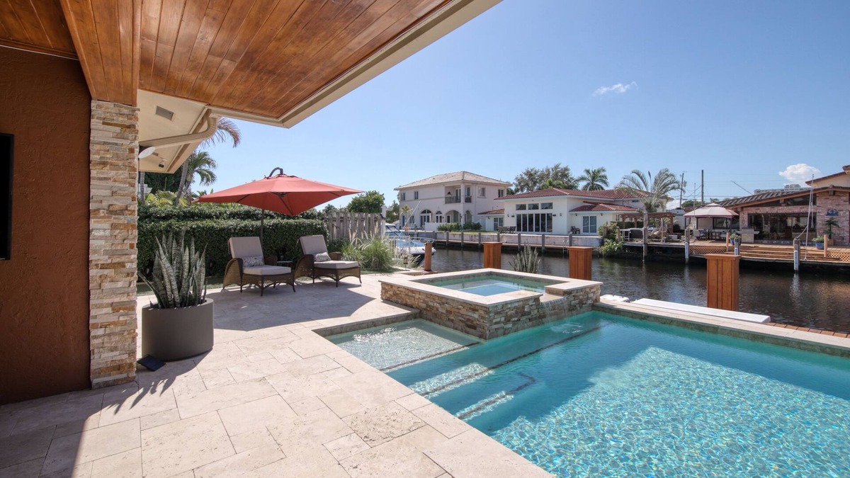 Pompano Isles House | Waterfront charmer with dock access, pool, hot tub, children's items, and W/D