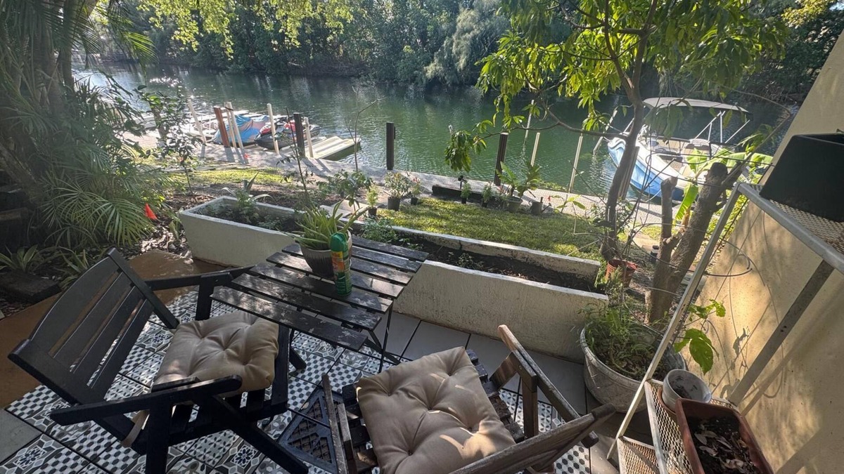 North Miami Condo | Waterfront Condo with Fishing, Paddleboard, and yard access.