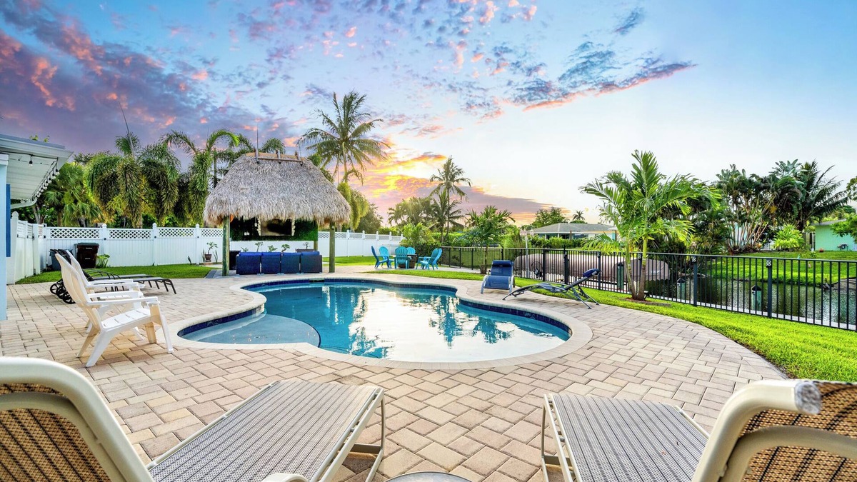 Lake Clarke Shores House | Waterfront Escape with Heated Pool, Mini-Golf, TikiHut in West Palm Beach