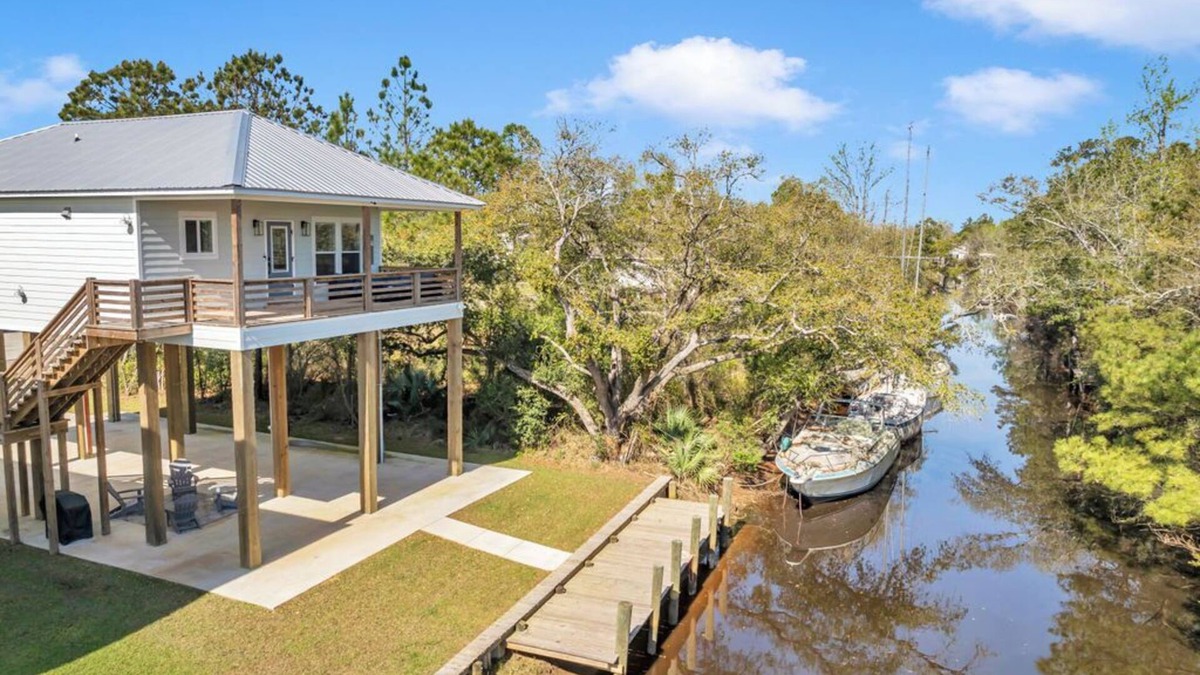 Shoreline Park House | Waterfront Escape in Bay STL with dock, ping pong, basketball, cornhole & more!