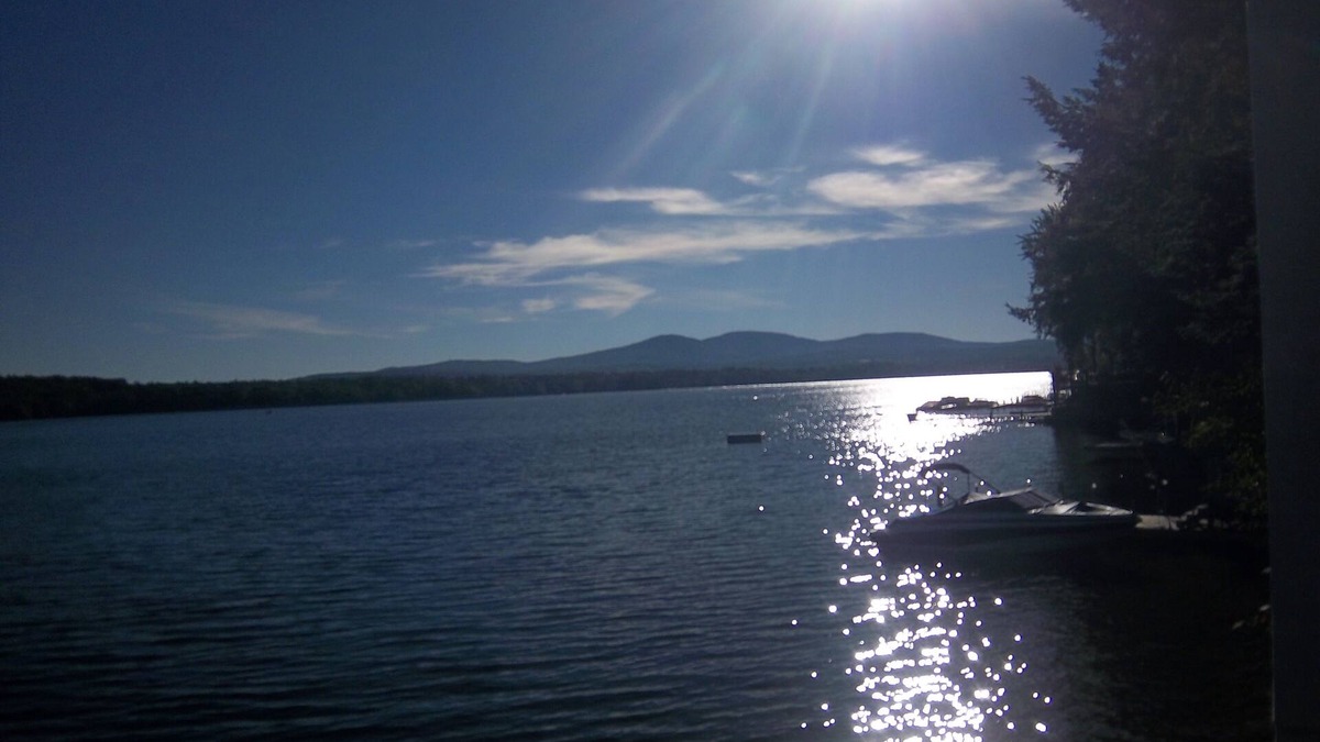 Laconia House | WATERFRONT HOME BOAT HOUSE BOAT SLIPS PANORAMIC LAKE AND GUNSTOCK MOUNTAIN VIEW