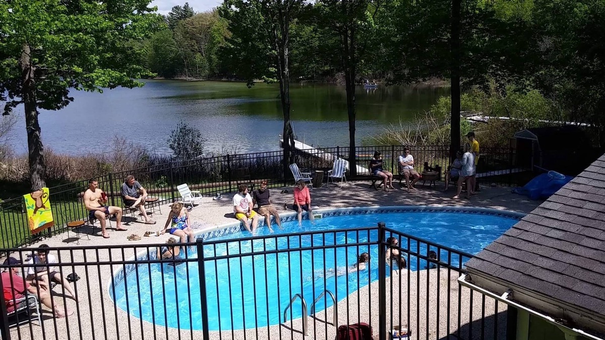 Interlochen House | Waterfront home in Lake Ann with outdoor pool. Pet ok, row boat, kayak, canoe