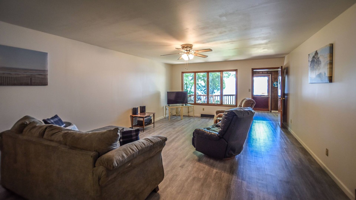 Onekama House | Waterfront home on Portage Lake with lake-view deck & firepit