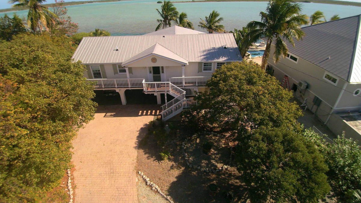 Bay Point House | Waterfront home with open water view, dock, hot tub, private beach, dog friendly