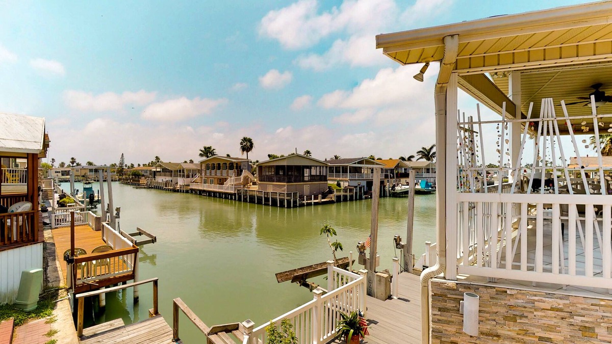 Port Isabel House | Waterfront home w/private dock & shared pools/hot tub/gym - 2 dogs welcome