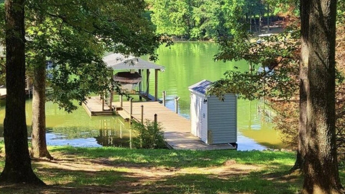 Smith Mountain Lake House | Waterfront house with dock, level lot, kayaks, park like setting, boat parking