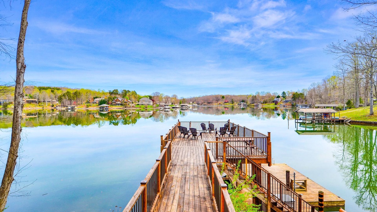Moneta Cottage | Waterfront lake-view home with dock, fireplace, pool table, kayaks, & firepit