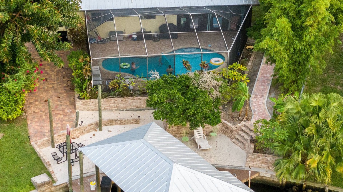 Apollo Beach House | Waterfront oasis with private heated & screened pool, dock w/boat lift. 3BR/2BA
