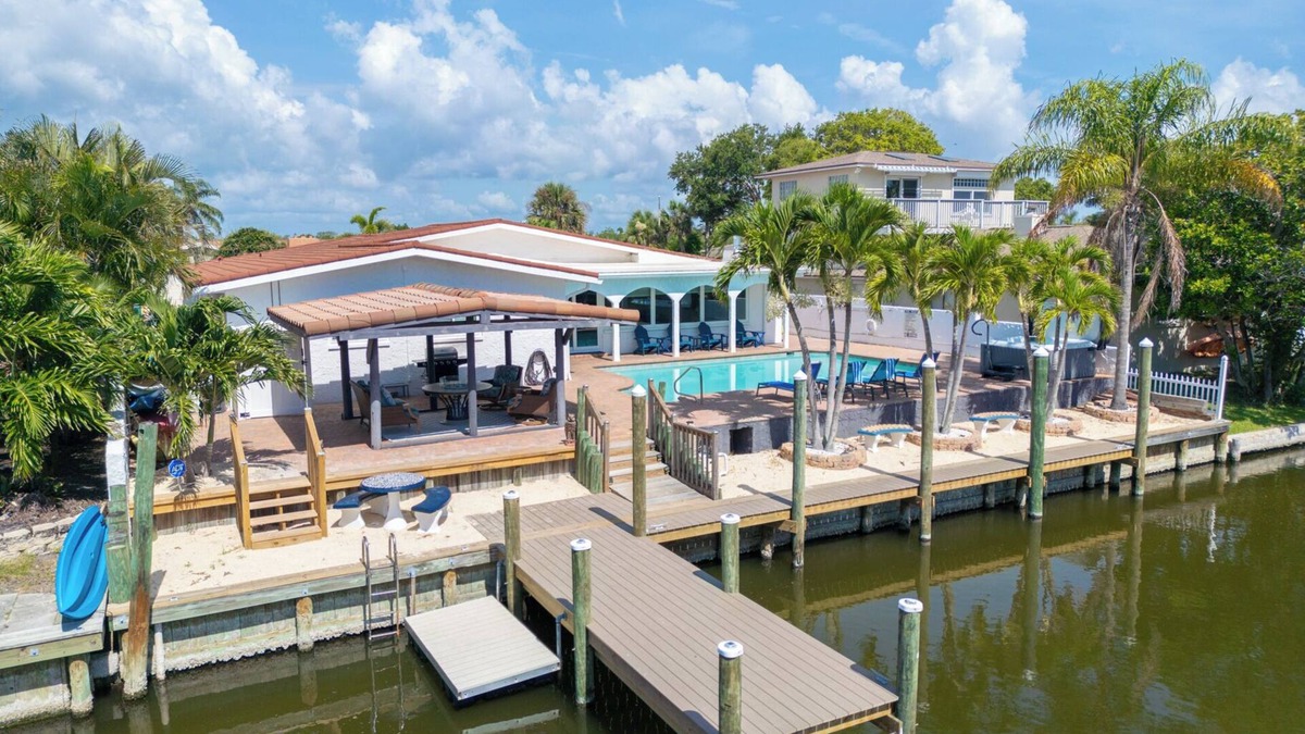 Cocoa Beach House | Waterfront Pool Home with Hot Tub & Fire Pit- Only 3 Minutes to the Beach!