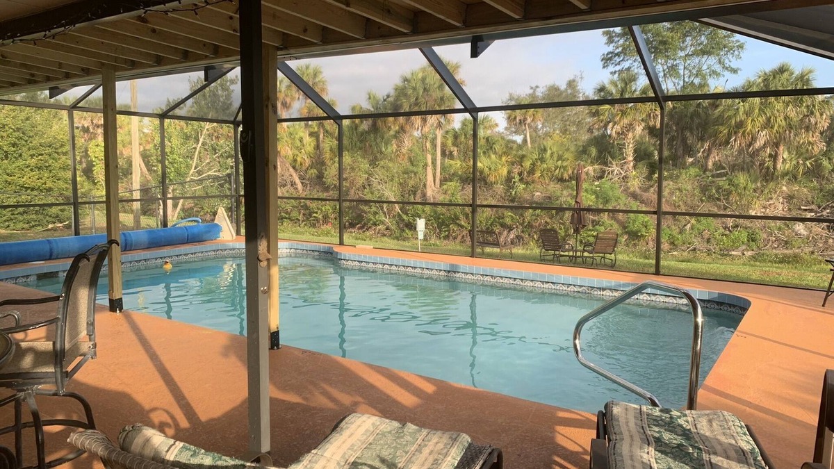 Venice Groves House | Waterfront single home rental with private lanai, heated pool, and hot tub!