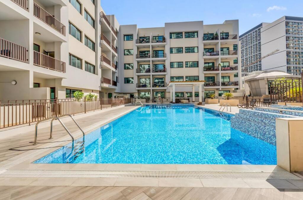 Jumeirah Village Circle Apartment | Waves - Comfortable 1BR Getaway in JVC With Park Views