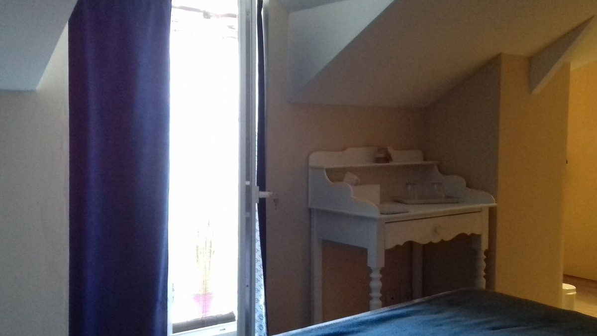 Bauge House | White room with private shower room and WC